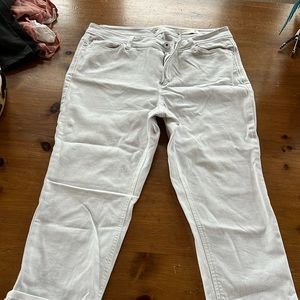 Hill white denim stretch jeans with bottom cuffs and back pockets.